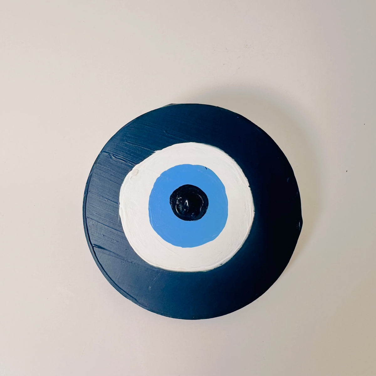 Achk Divine Guardian Number Two dark blue evil eye ceramic amulet by Melbourne artist Ani Ipradjian, a collectible wall hanging representing spiritual strength and protection.