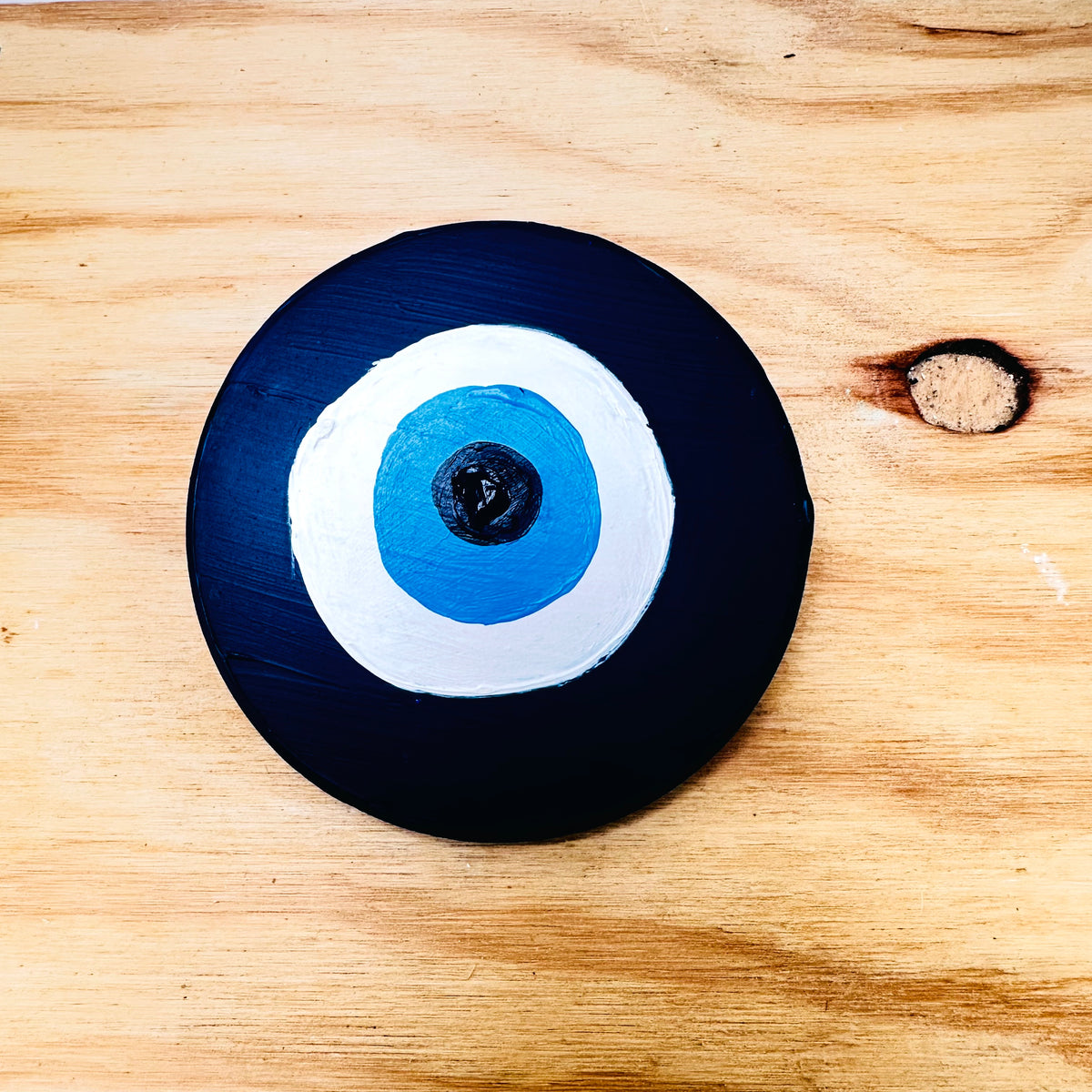 Achk Divine Guardian Number Two dark blue evil eye wall hanging by Ani Ipradjian, a ceramic protection amulet symbolising defence against curses and jealousy.