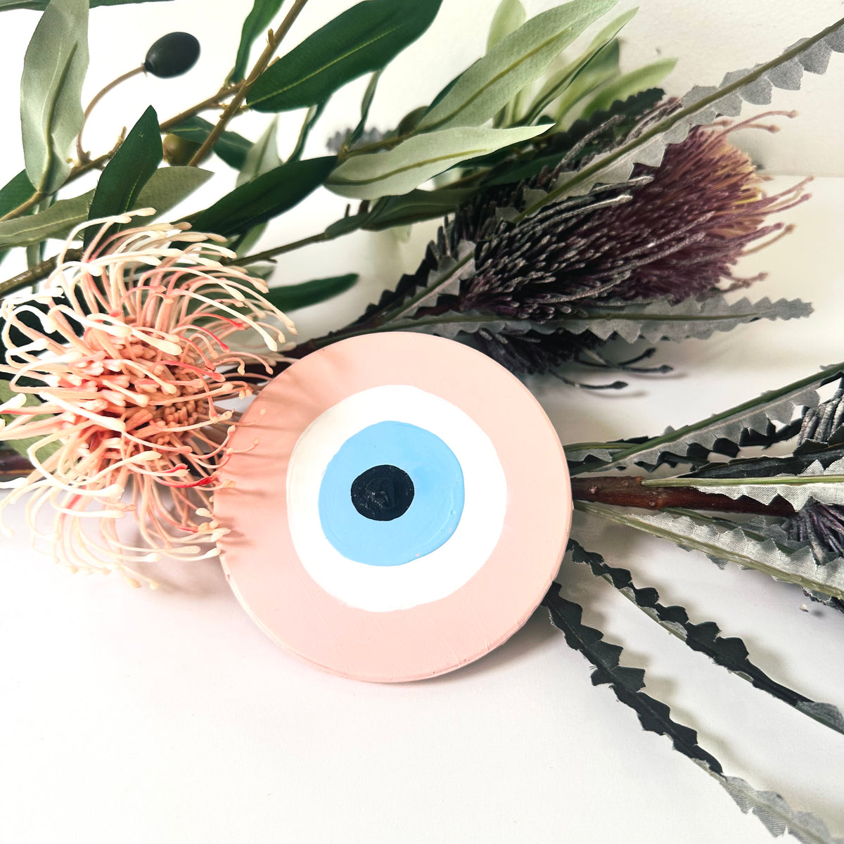 Achk Love Guardian pink evil eye wall art by Ani Ipradjian, a spiritual home decoration inspired by unconditional love and protection against jealousy.