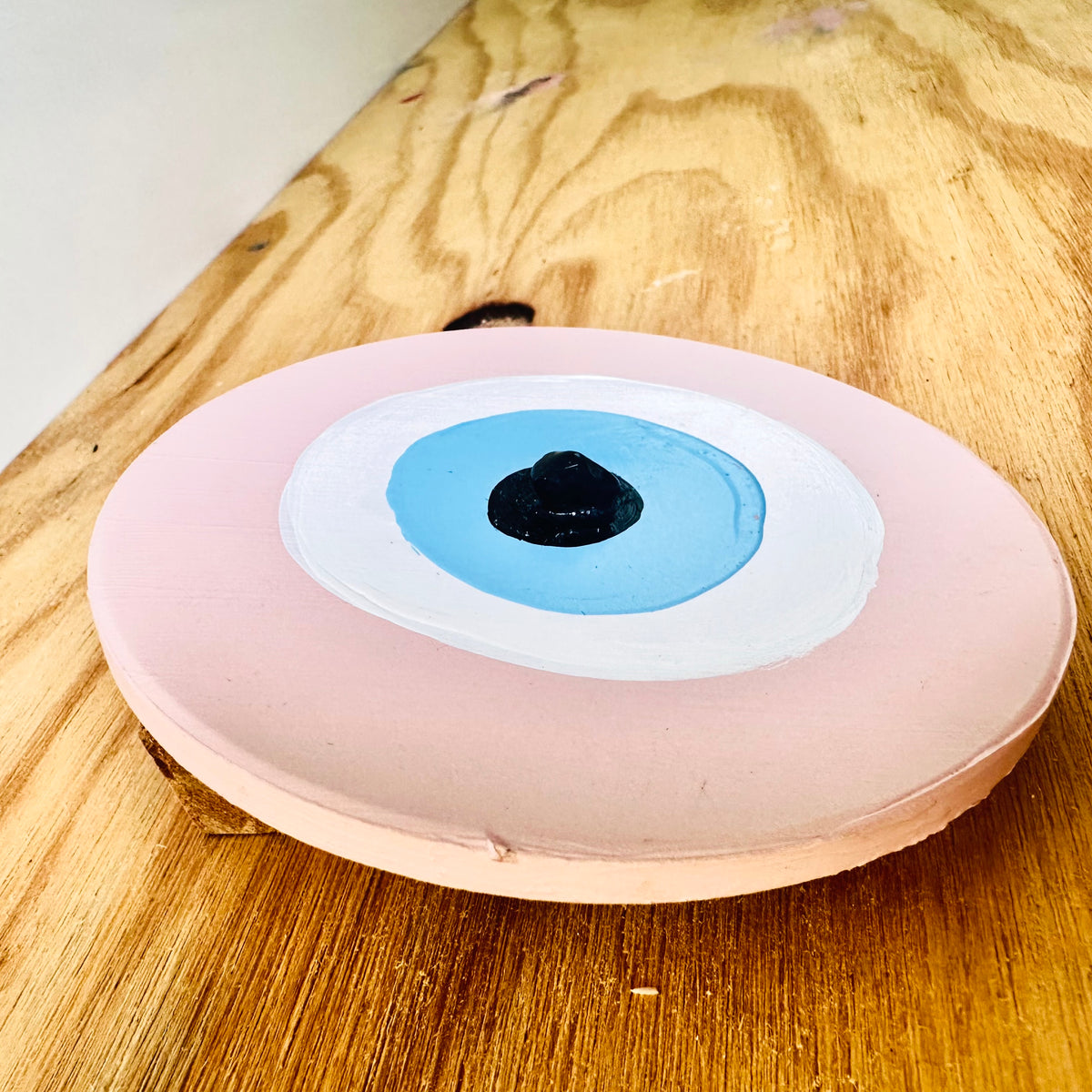 Achk hand-painted pink evil eye by Australian artist Ani Ipradjian, a ceramic wall ornament associated with protection for couples, families and friendships.
