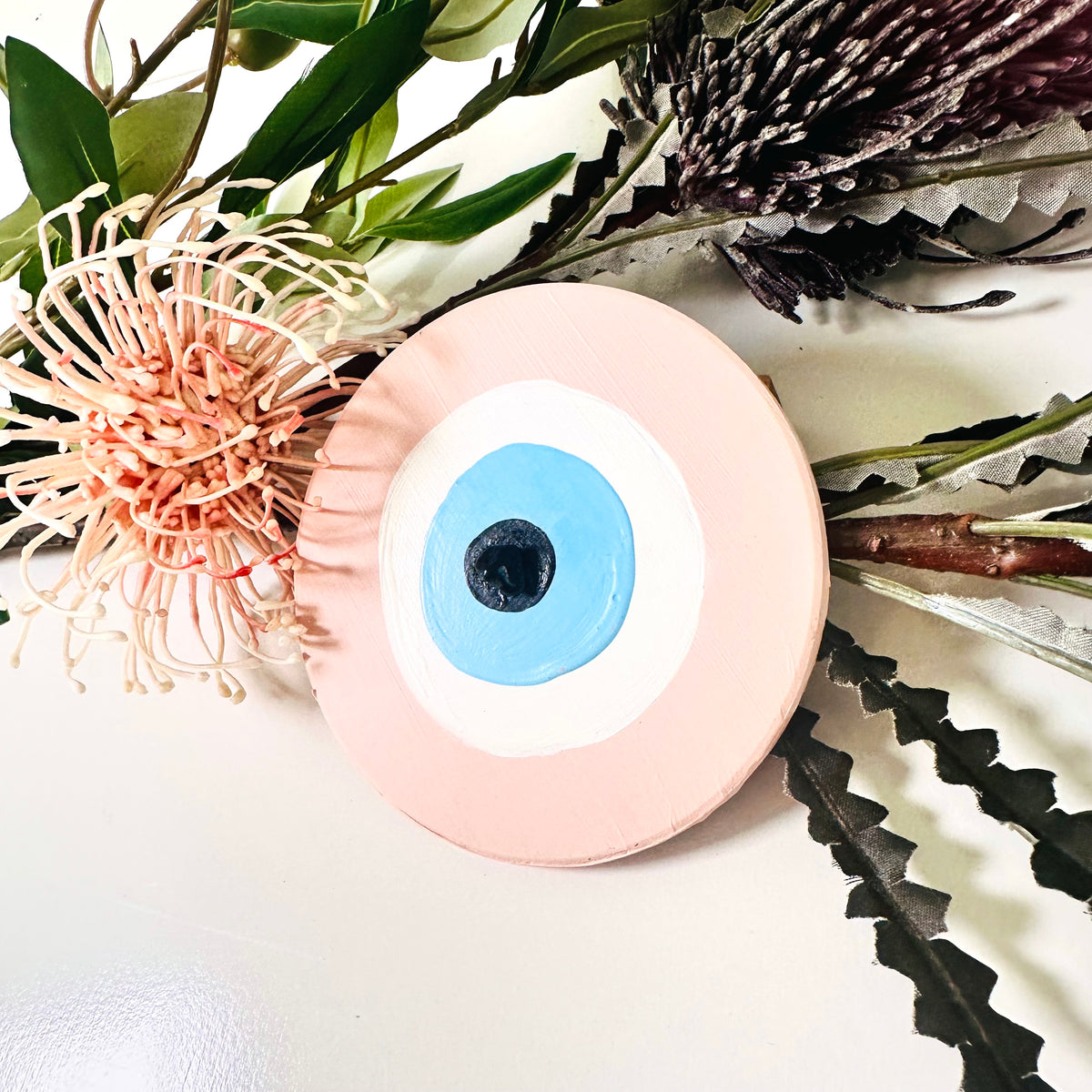 Achk pink ceramic evil eye wall hanging by Ani Ipradjian, a meaningful spiritual gift representing protection against envy and negative relationship energy.
