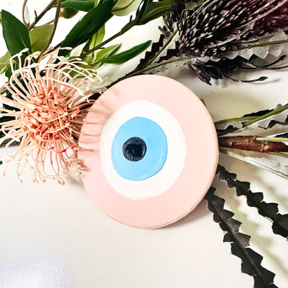 Achk pink ceramic evil eye wall hanging by Ani Ipradjian, a meaningful spiritual gift representing protection against envy and negative relationship energy.