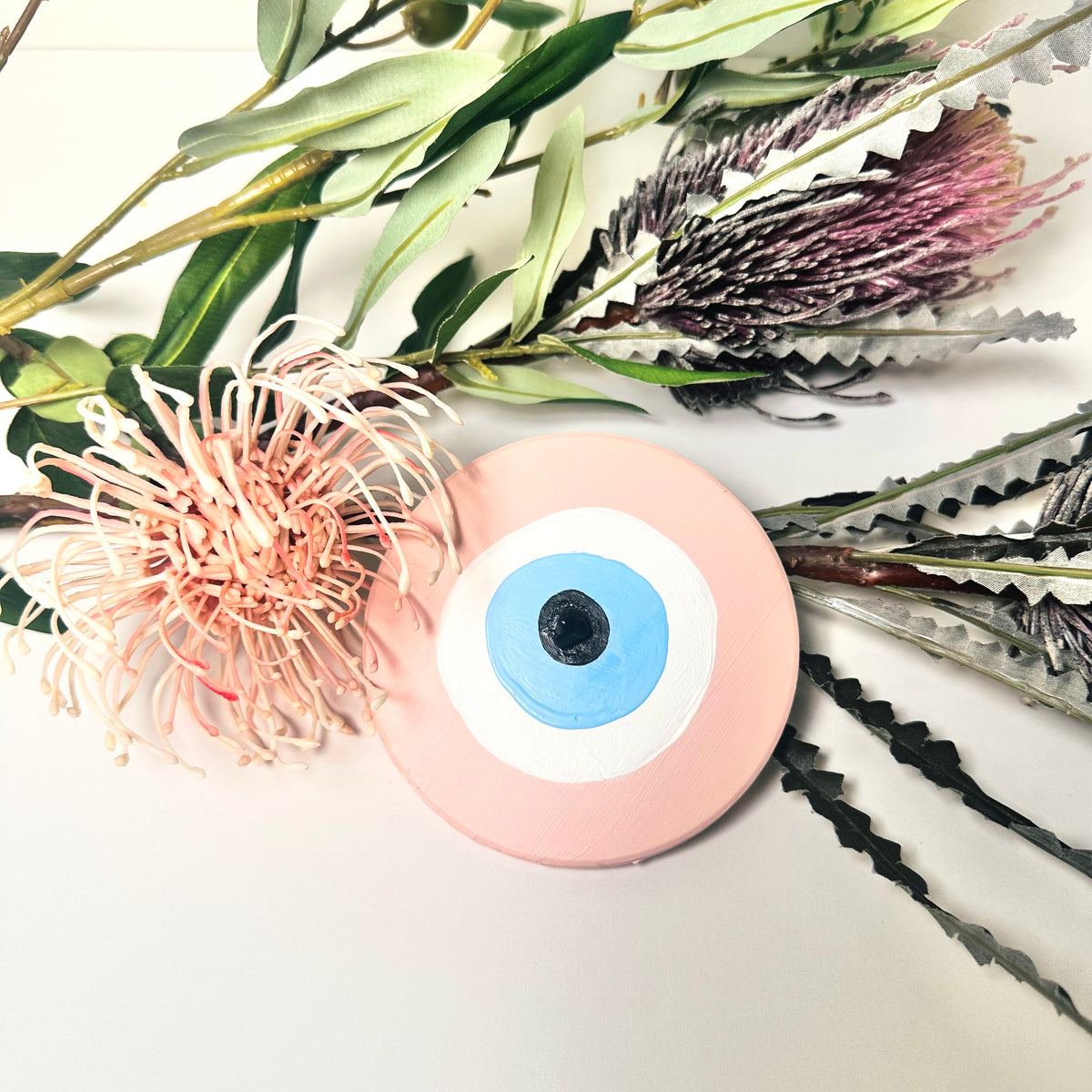 Achk pink evil eye ceramic wall hanging by Australian artist Ani Ipradjian, a hand-painted love protection amulet symbolising emotional healing and heart protection.