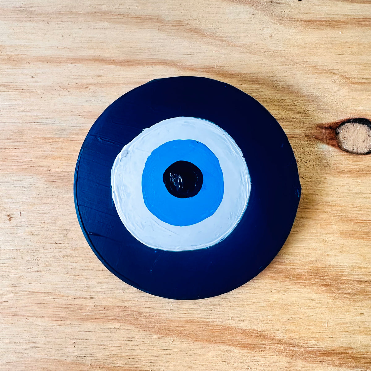 Divine Guardian Number Two ceramic evil eye protection wall hanging by artist Ani Ipradjian, an Achk dark blue amulet for spiritual home protection.