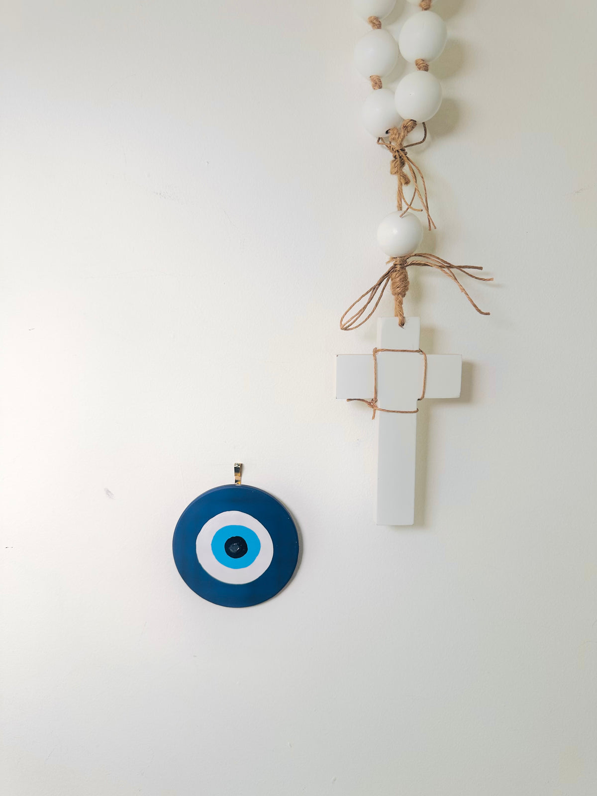 Divine Guardian Number Two hand-painted dark blue ceramic evil eye by Ani Ipradjian, an Achk wall hanging symbolising protection against gossip and negative intentions.