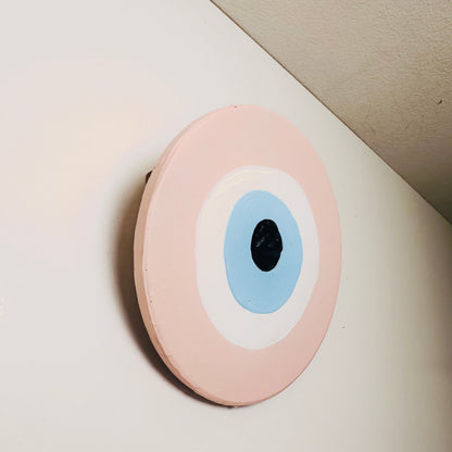 Love Guardian Achk pink evil eye wall hanging by Ani Ipradjian, handcrafted ceramic art representing healing after heartbreak and welcoming new love.