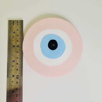 Love Guardian handmade pink evil eye ceramic amulet by Australian artist Ani Ipradjian, an Achk artwork symbolising self-love, emotional strength and renewal.