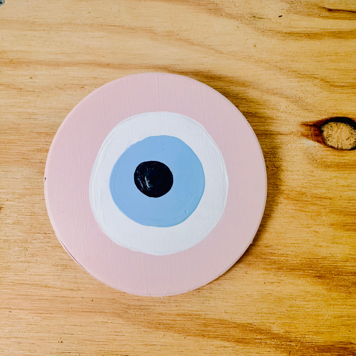 Pink evil eye ceramic protection amulet by Ani Ipradjian, an Achk wall hanging symbolising love, forgiveness, emotional balance and new beginnings
